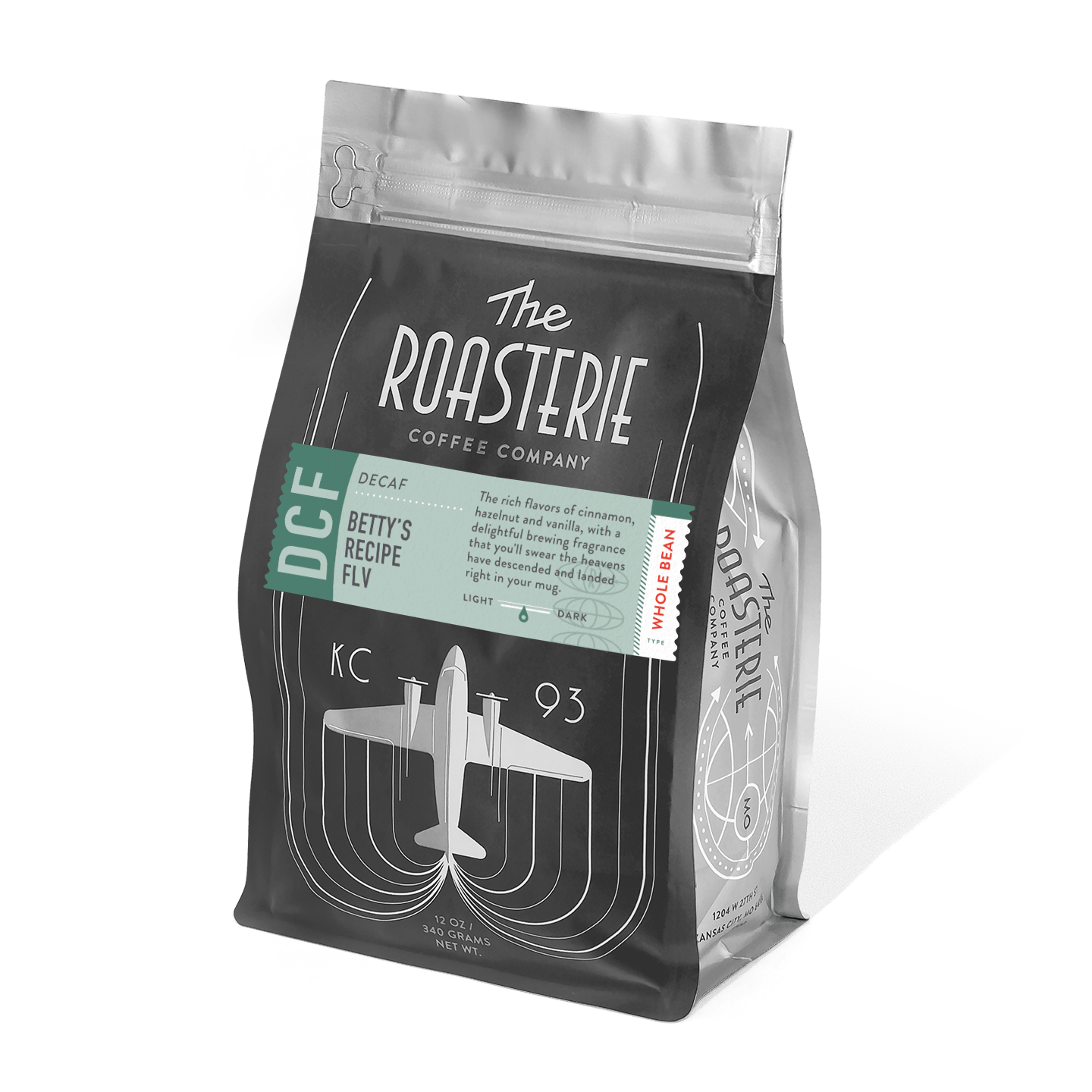 A black coffee bag of Betty's Recipe Decaf by The Roasterie featuring an art deco-style airplane design and mint green label. The package displays retro-inspired typography and KC 93 branding against a sleek, resealable bag.