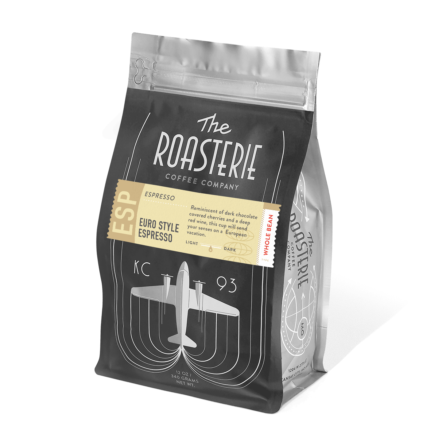 A bag of Euro Style Espresso coffee from The Roasterie featuring dark vintage-inspired packaging with an airplane design. The bag showcases elegant curved lines and metallic accents, promising rich flavors of dark chocolate covered cherries and deep red wine.