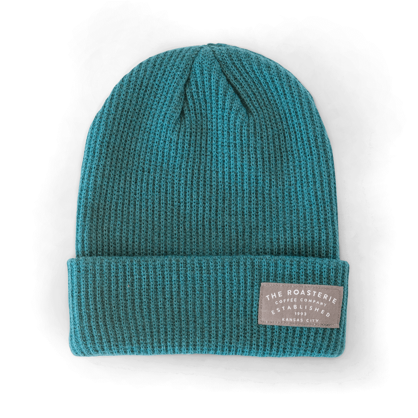 Knit Patch Beanie in vibrant teal color with ribbed texture, featuring a folded cuff and gray branded patch. Warm winter hat with classic beanie styling and vertical knit pattern, perfect for showing Kansas City pride.