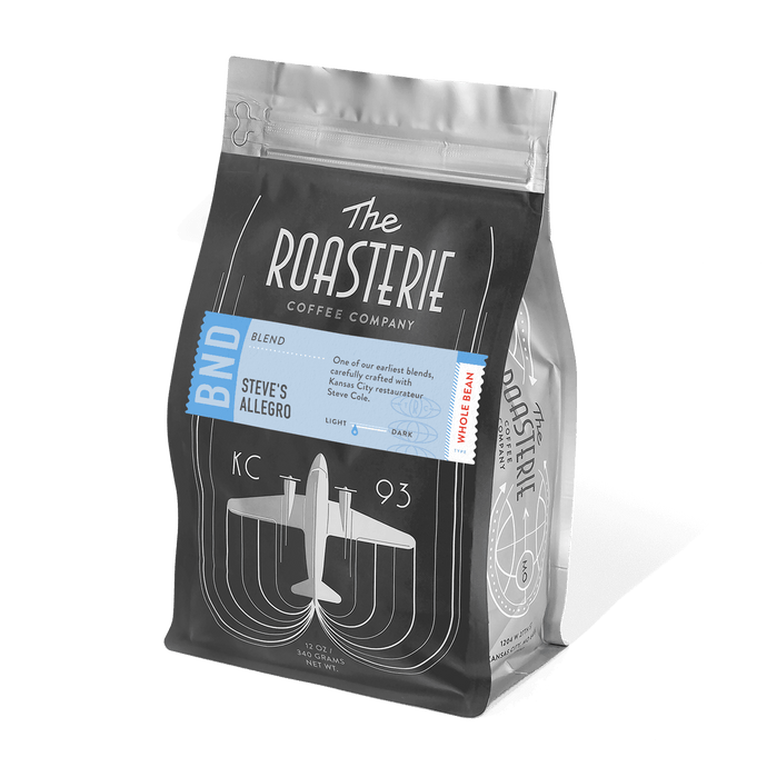 Steve's Allegro Blend coffee bag from The Roasterie featuring black packaging with vintage airplane design, blue label accent, and resealable top. Premium coffee blend with notes of cherry and pecan, crafted in Kansas City since 1993.